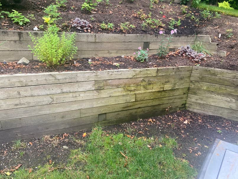 Tiered wood retaining wall and garden bed built by C&J General Services
